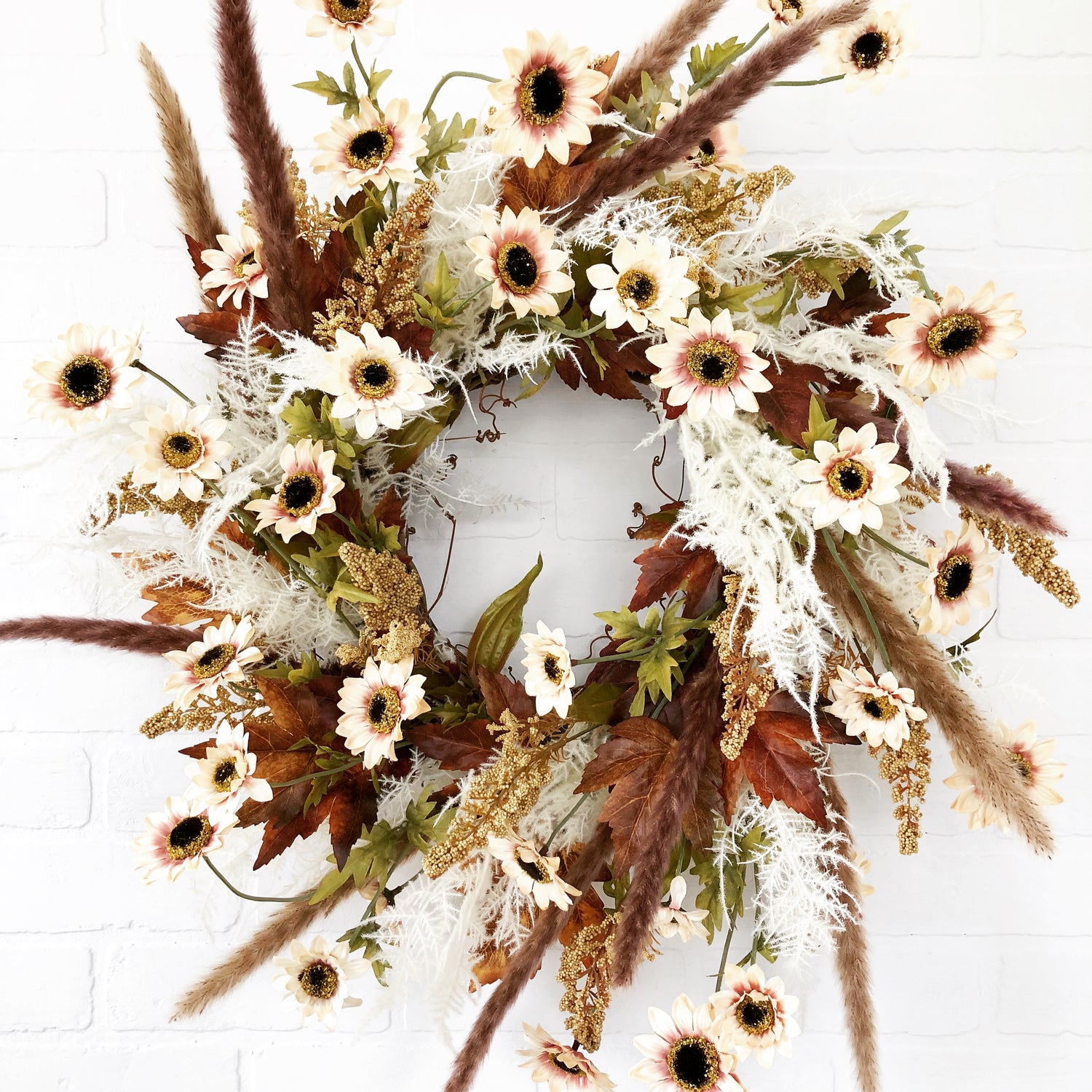Fall front door wreath of mini white sunflowers, fern, pampas grass and pheasant feathers